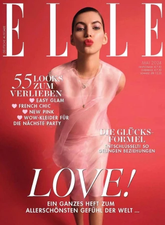 Elle magazine cover featuring a female model wearing a sheer pink top, posing with pursed lips, on a solid pink background.