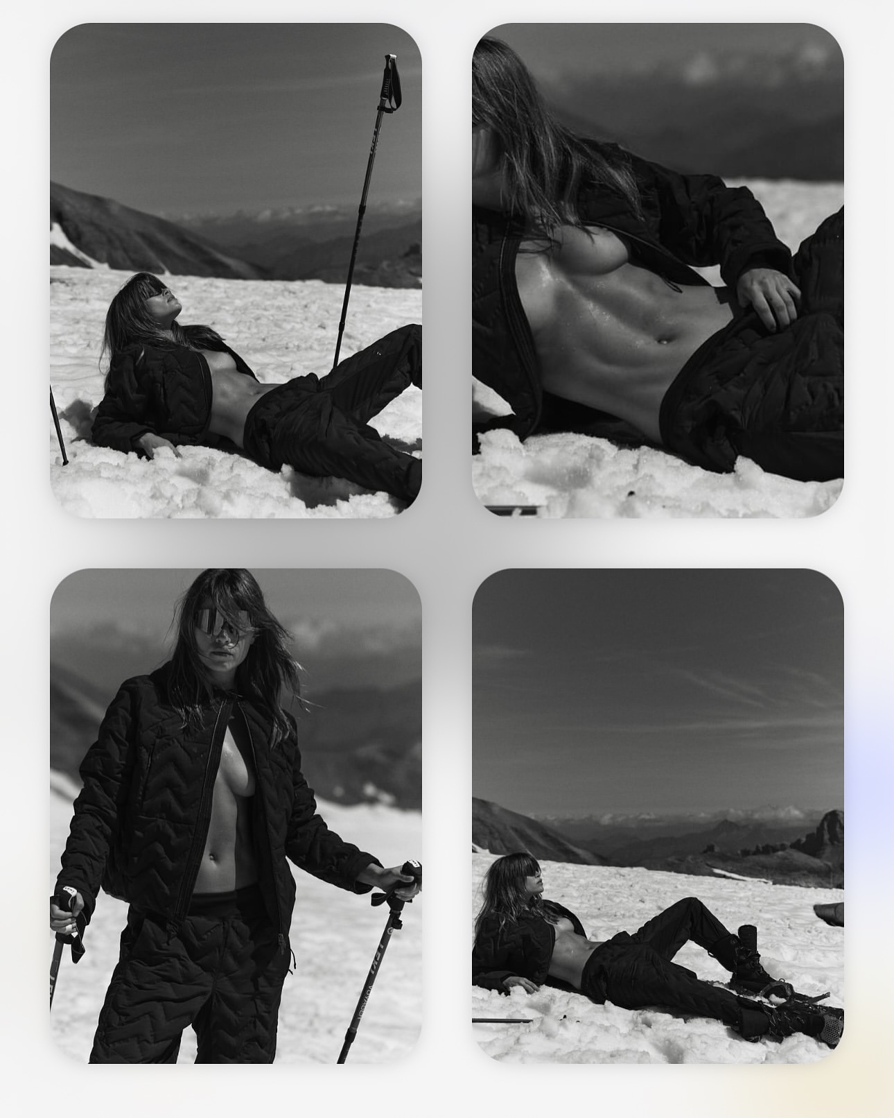 Black and white fashion shot of an adult female model posing in the snow wearing outdoor quilted apparel with mountains in the background.