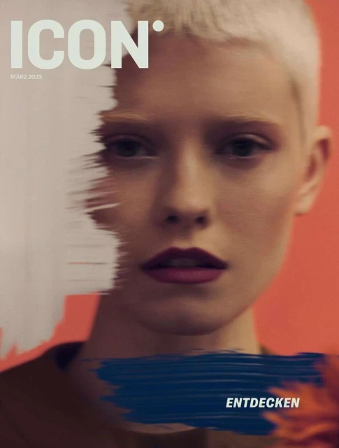 Fashion magazine cover features a light-skinned woman with a short blonde haircut against an orange and white background.