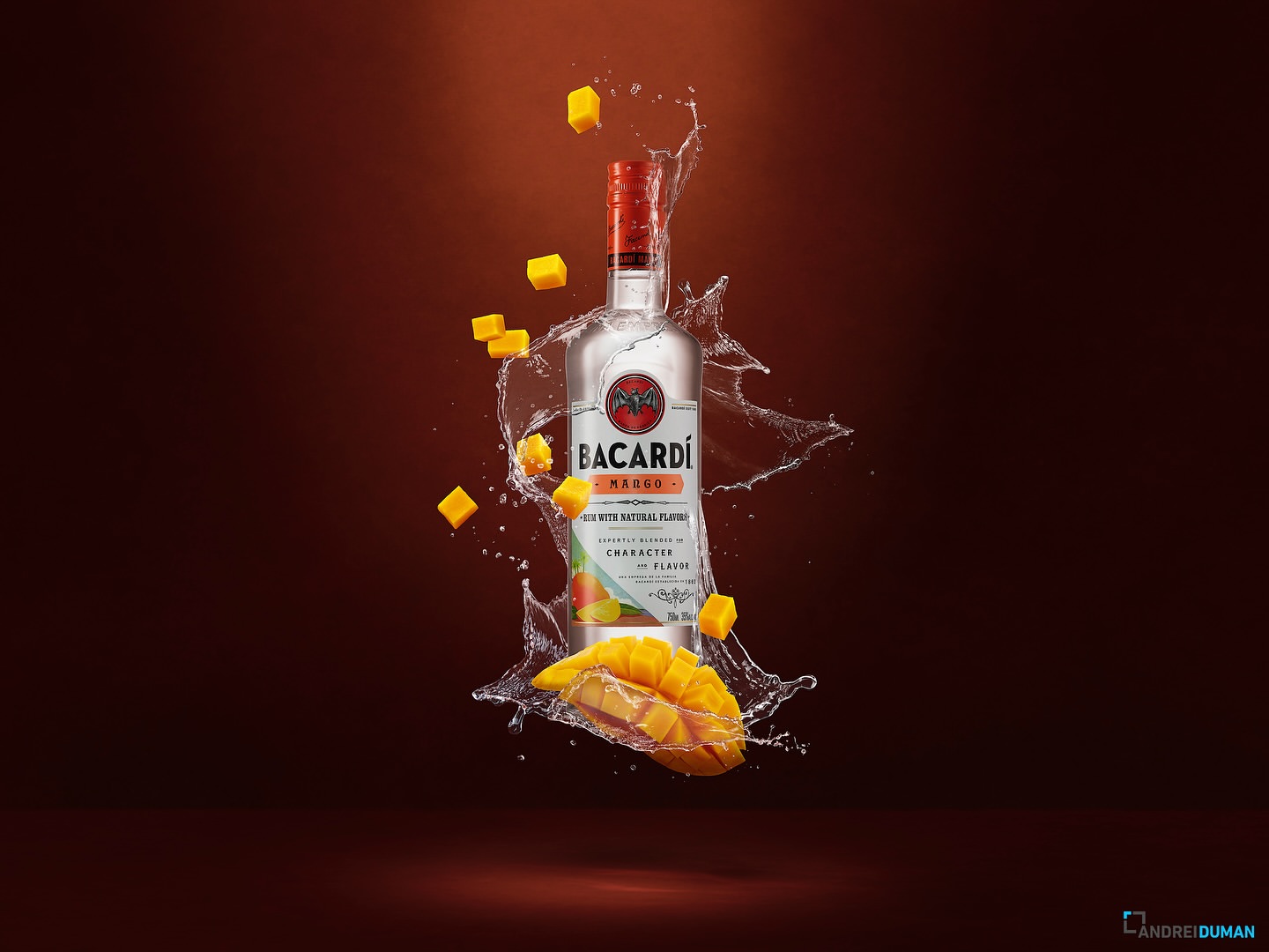 Bacardi Mango rum bottle with mango chunks and water droplets on a brown gradient background, product photography for food and beverage.