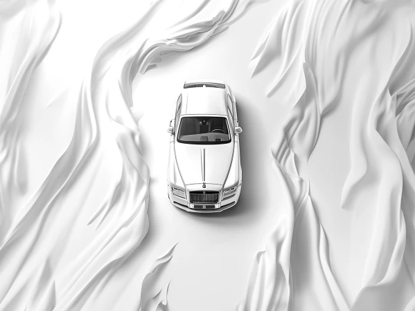 Overhead shot of a white luxury car surrounded by swirling white fabric, creating a minimalist and elegant automotive advertisement.