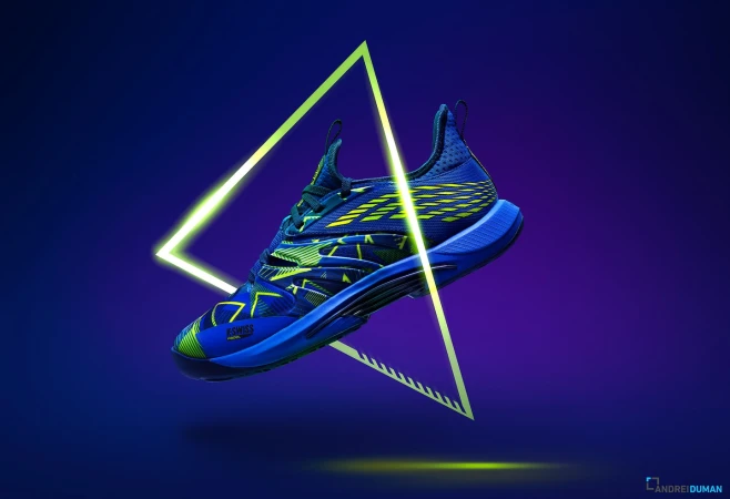 Blue and green K-Swiss tennis shoe levitates against a vibrant blue and purple gradient backdrop with a neon triangle in the background.