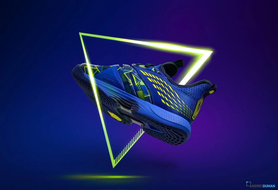 Dynamic studio shot of a blue athletic shoe with yellow accents, levitating against a vibrant purple and blue gradient backdrop and neon triangle.