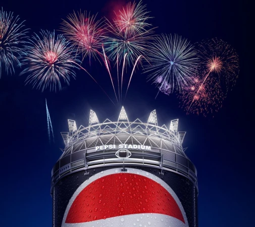 Pepsi Stadium on a can with fireworks. Dark blue background with festive and celebratory imagery; stadium with a can base and stadium topper.