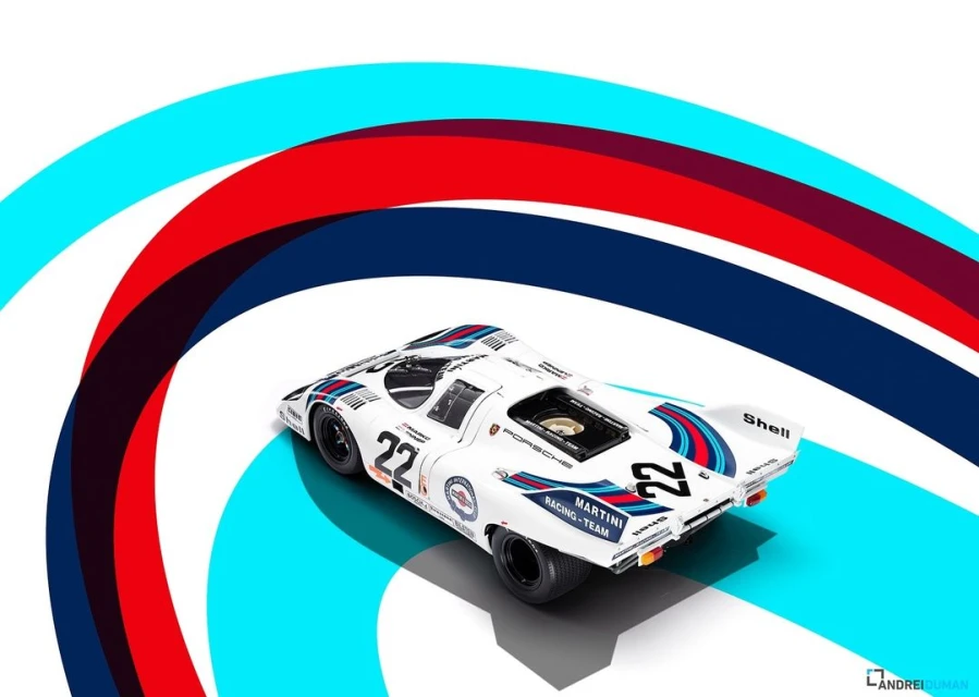 A white Porsche race car with blue and red stripes, number 22, sits on a white surface with curved stripes overhead.