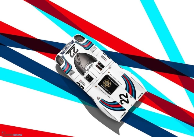 Overhead shot of a white race car with blue and red accents, number 22, and brand logos on a white background with stripes.