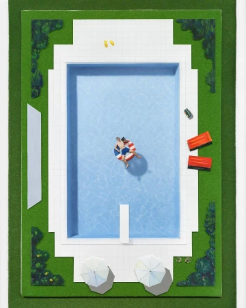 Aerial view of a couple floating on an inflatable in a swimming pool surrounded by green grass and white umbrellas on a sunny day.