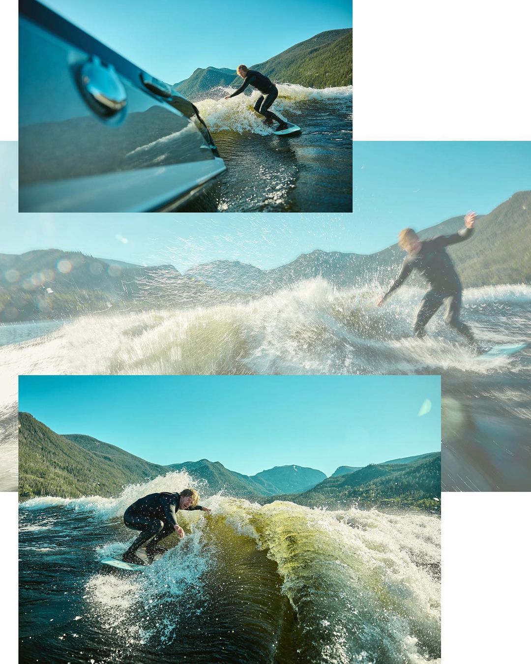 A person wake surfing in a lake surrounded by mountains. The wakeboarder is riding a large wave created by a boat, clear blue sky.