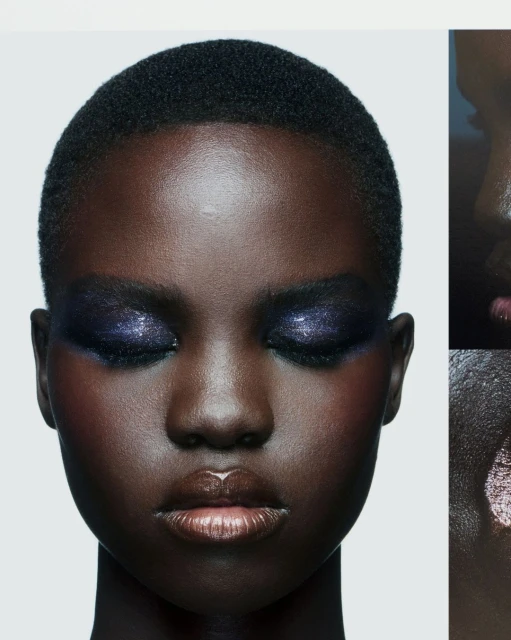 Close-up portrait of a Black female model with dramatic purple eyeshadow, glossy lips, and short dark hair against a white background.
