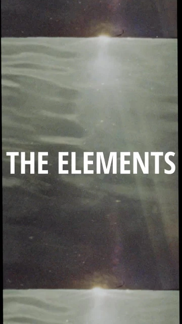 Abstract seascape with the text 'The Elements' in white, showing a sunlit body of water beneath a blurred dark horizon.
