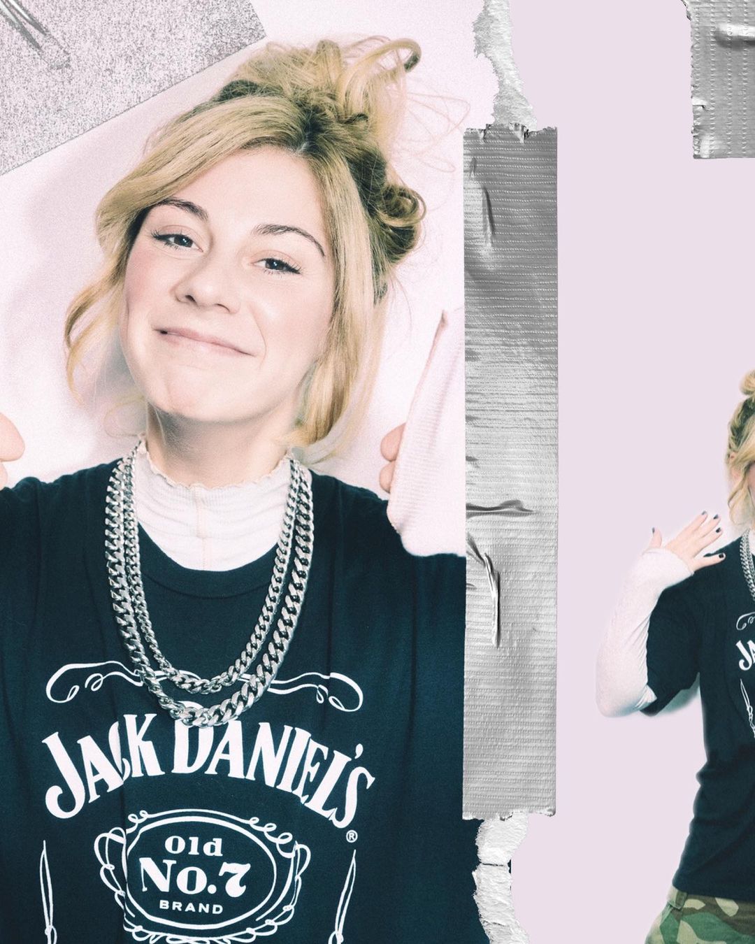 Smiling woman wearing a Jack Daniel's t-shirt and silver chains poses in a studio with tape and a felt board for a trendy aesthetic.