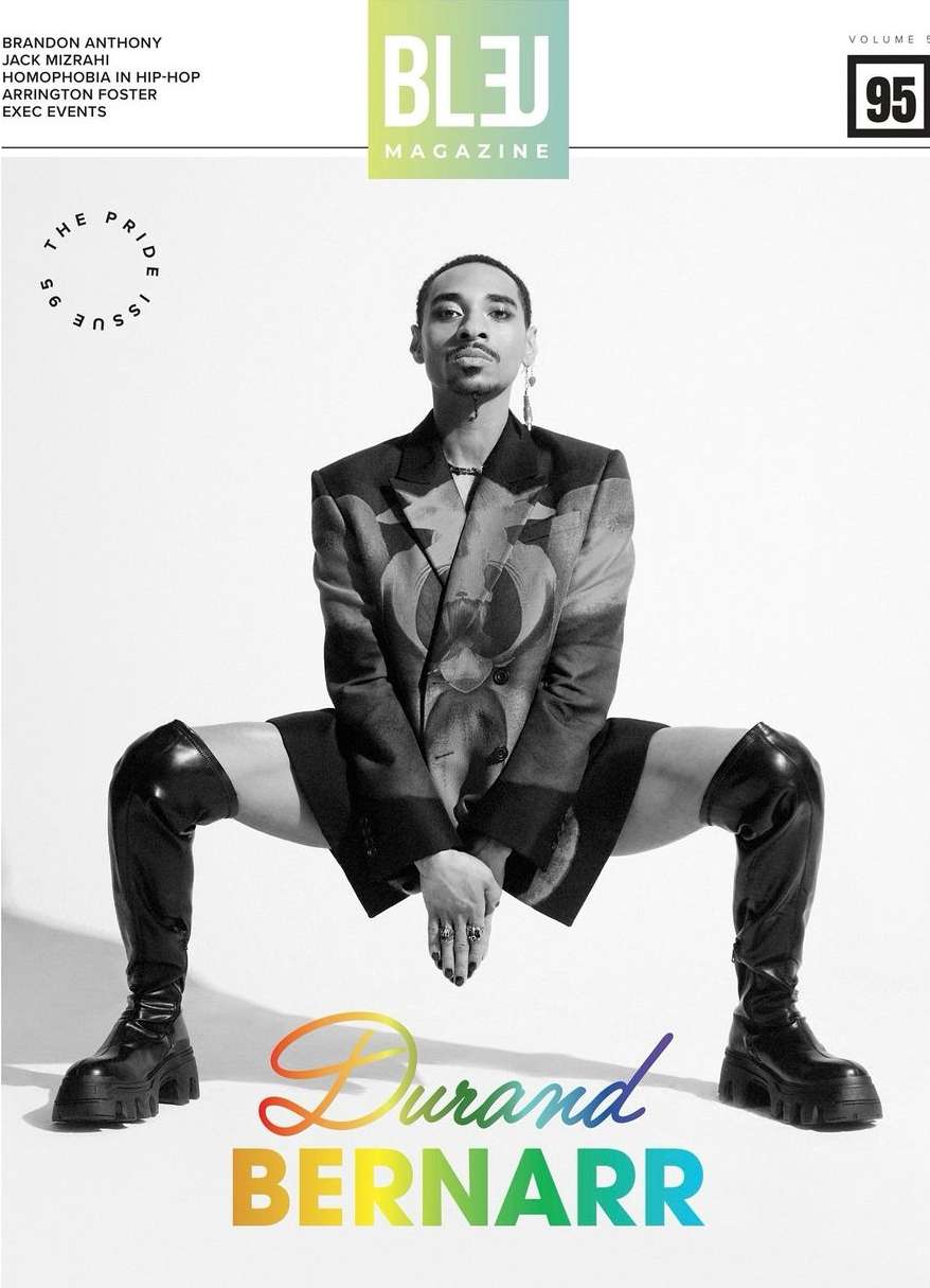 Bleu Magazine cover featuring a Black male model in a blazer and thigh-high boots, positioned against a white backdrop with colorful text.