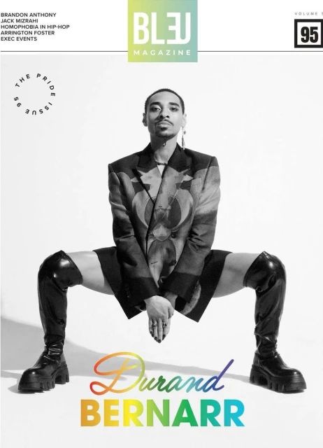 Bleu Magazine cover featuring a Black male model in a blazer and thigh-high boots, positioned against a white backdrop with colorful text.