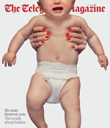 Magazine cover featuring a baby held by adult hands, showcasing the infant's expression and diaper against a white backdrop.