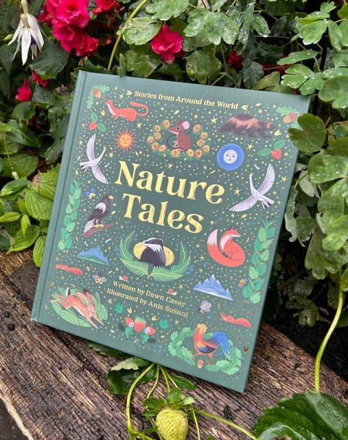 A nature-themed book titled "Nature Tales" with colourful illustrations, set amongst green leaves, red flowers and a strawberry.