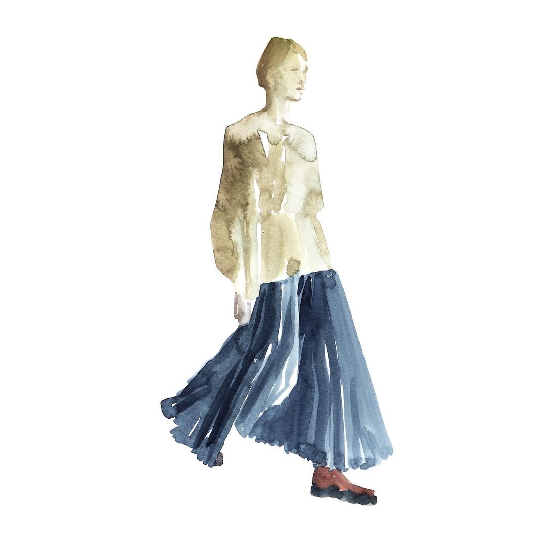 An illustration depicts an androgynous fashion model with a neutral expression, wearing a beige blouse and a flowing, dark blue skirt.