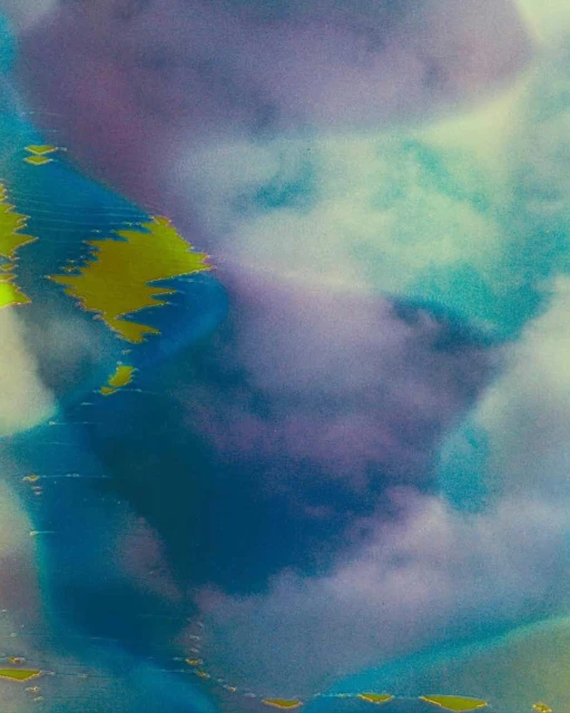 Abstract image featuring a blend of vibrant blues, purples, and yellows, creating a dynamic and textured visual composition.