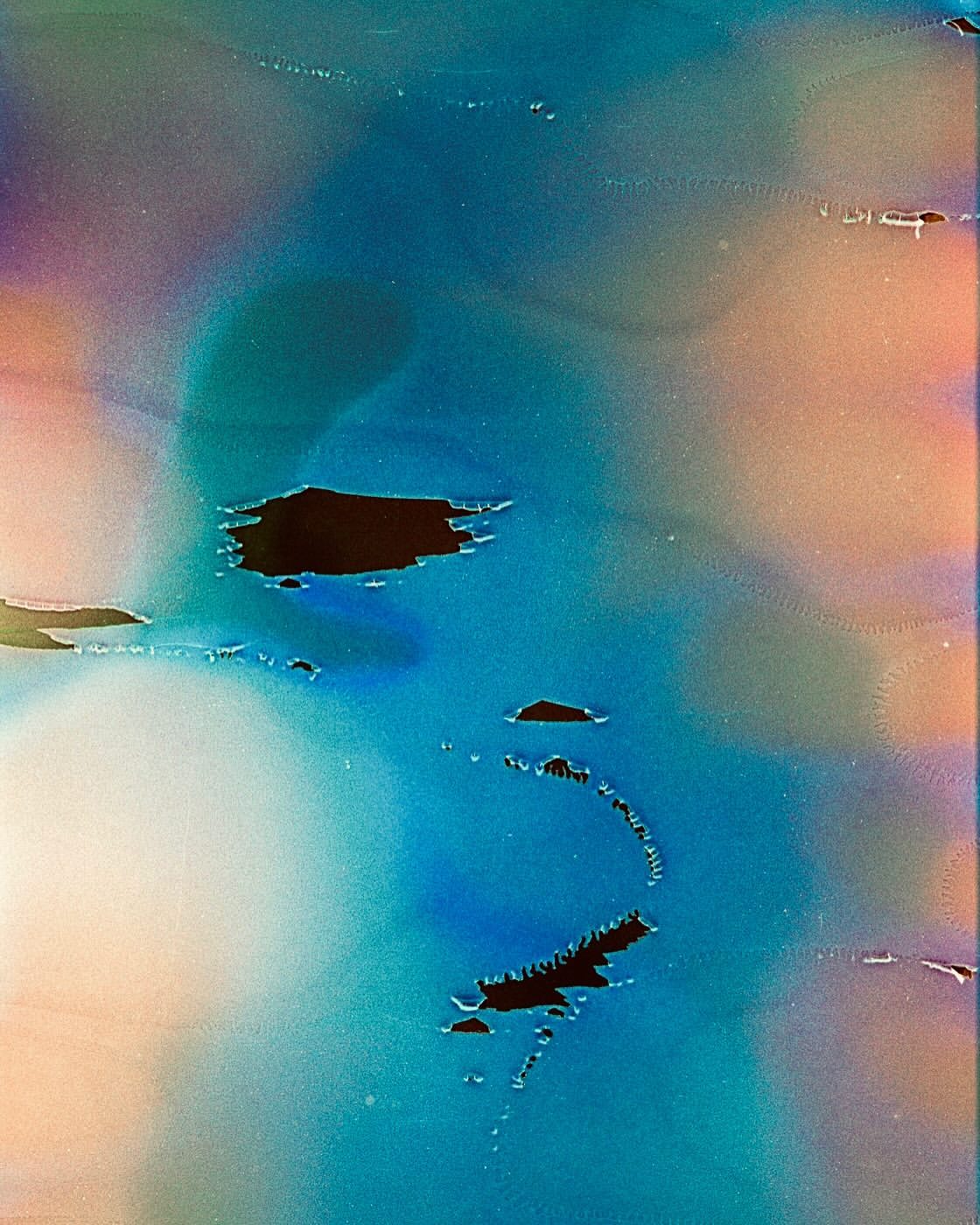 Abstract background featuring an interplay of blues, pinks, and black details, creating a surreal, dreamlike atmosphere with unique color gradients.