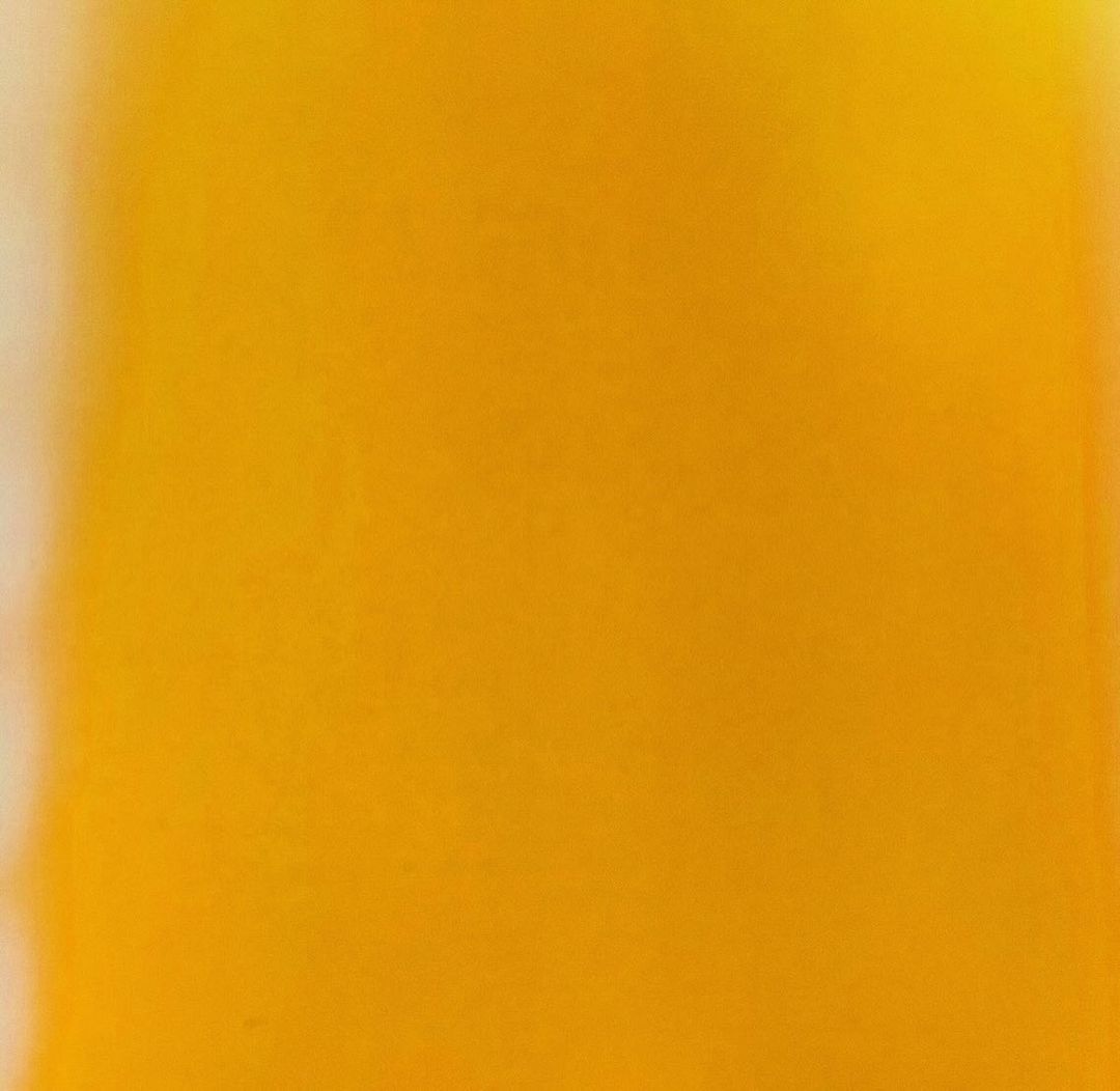 Abstract gradient background with dominant yellow hue and soft transition to lighter shade, creating a vibrant and blurred effect.