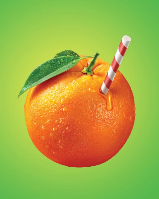 An orange fruit with a green leaf and a striped straw, set against a gradient green background, highlights the vibrant colors.