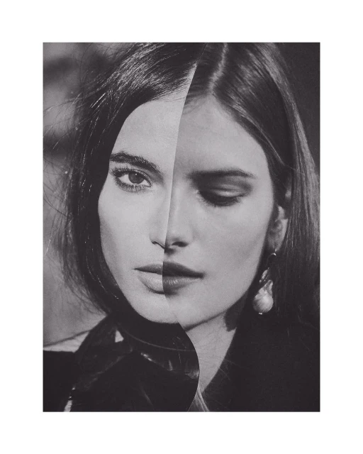 Monochromatic portrait of a split-face woman, one side with closed eyes and pearl earring, the other side with open eyes, stylish hair.