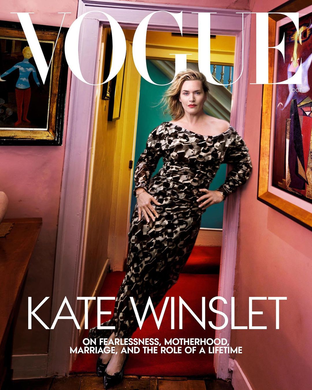 Kate Winslet on the cover of Vogue, wearing a long patterned dress, leaning against a doorframe in a hallway with colorful walls and artwork.