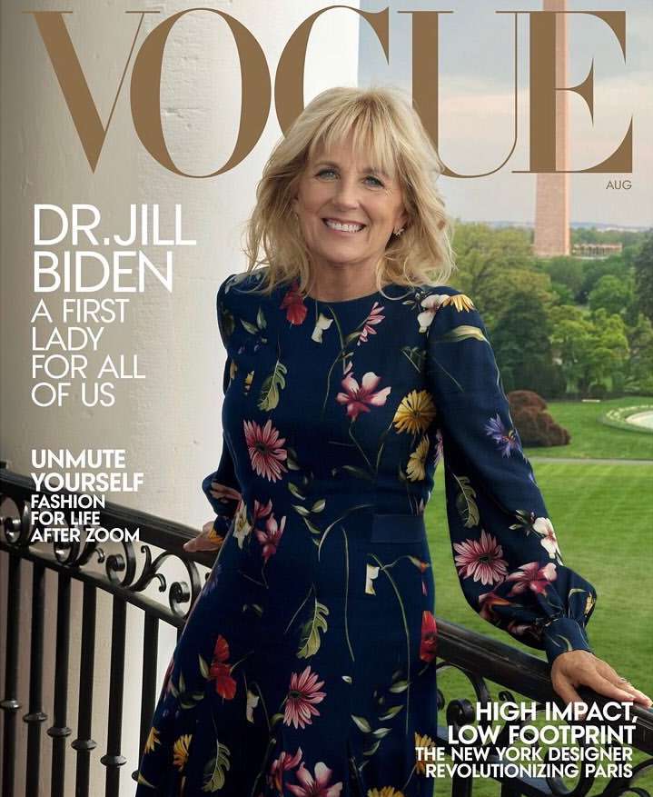 Vogue cover featuring Dr. Jill Biden in a floral dress, smiling against a backdrop of the White House and green landscape in August.