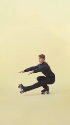Man wearing roller skates balancing in a single-leg squat pose against a solid light yellow background
