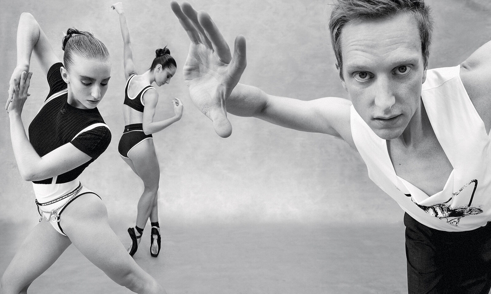 Black and white photograph features three dancers in motion in a photo studio against a neutral background in medium and close up shots.