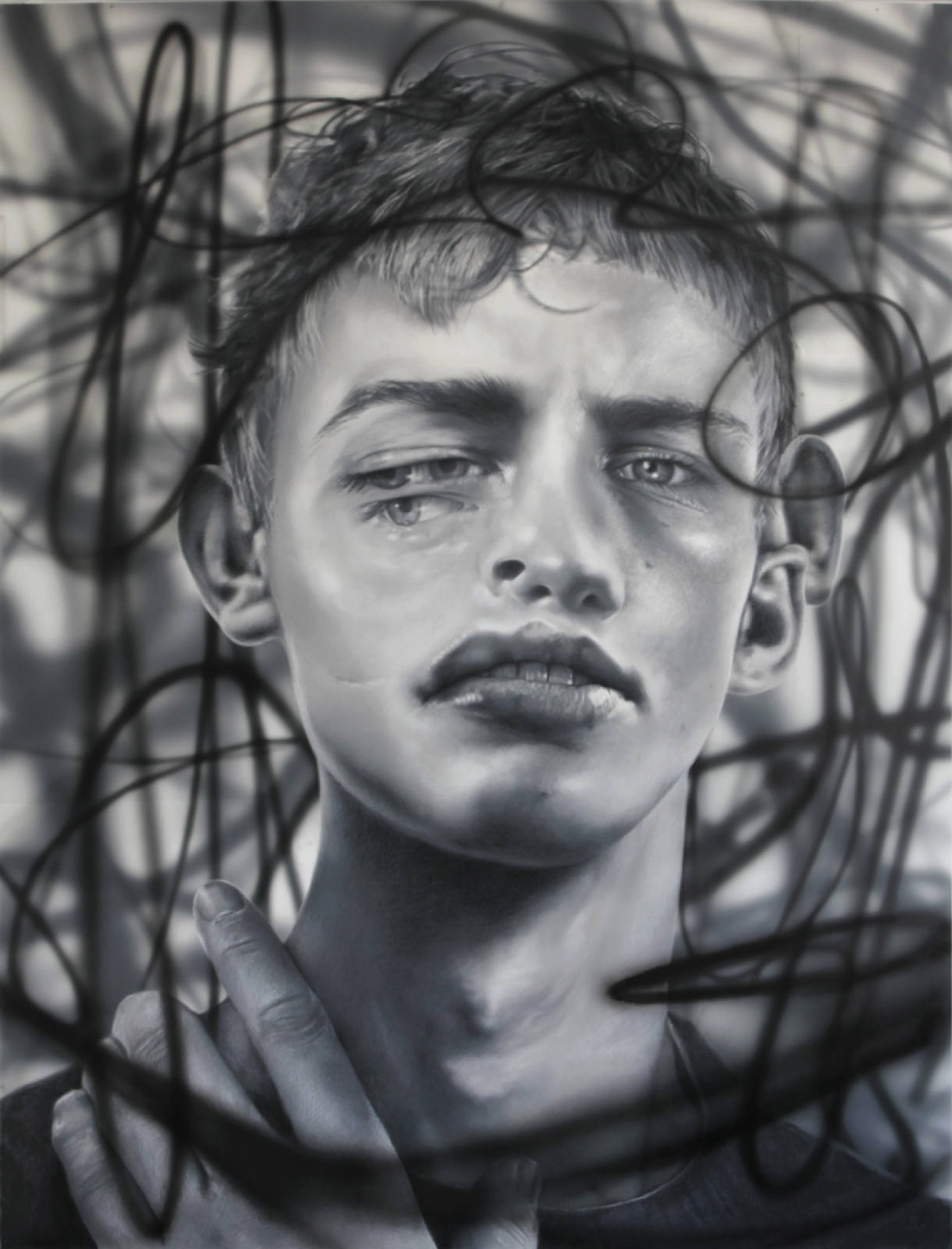 Monochrome portrait of a young man with tousled hair, gazing slightly off-center amidst a background of abstract, swirling lines.