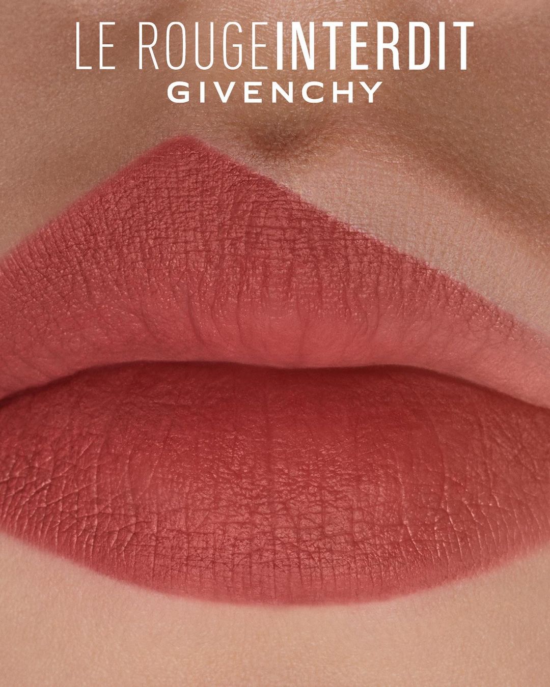 Close-up studio shot of lips with lipstick in a neutral, rosy-peach tone, with brand text "Le Rouge Interdit" and "Givenchy".