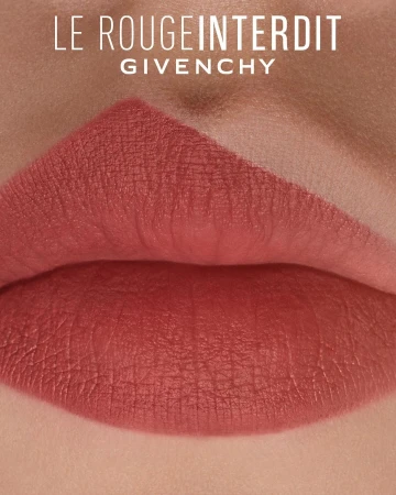 Close-up studio shot of lips with lipstick in a neutral, rosy-peach tone, with brand text "Le Rouge Interdit" and "Givenchy".