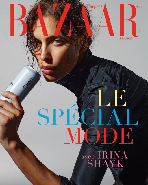 Magazine cover featuring Irina Shayk in black top, holding a Cano water bottle, against a light gray background with bold text.
