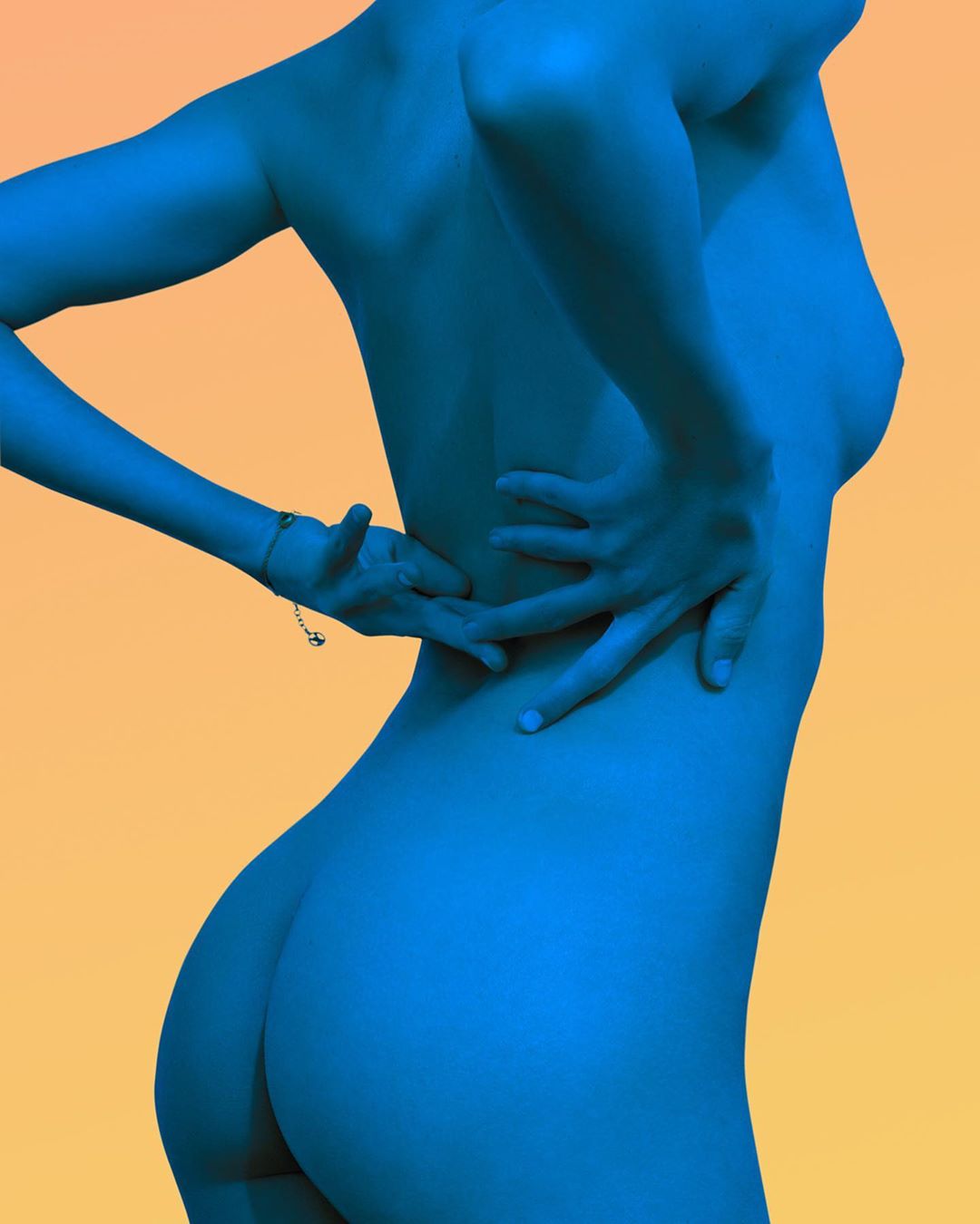 Blue-toned nude female torso and back with hands resting on lower back. Soft yellow background.