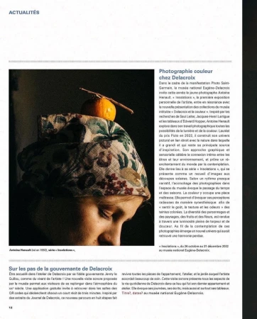 Close-up studio shot: Young woman wearing a patterned headscarf and a piece of fruit on her head, eyes closed.