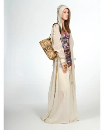 Model wearing a sheer hooded robe over a patterned dress holding a leopard print shoulder bag against a white background