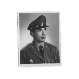Black and white portrait of a man in military uniform with a peaked cap, by photographer Aria Shahrokhshahi