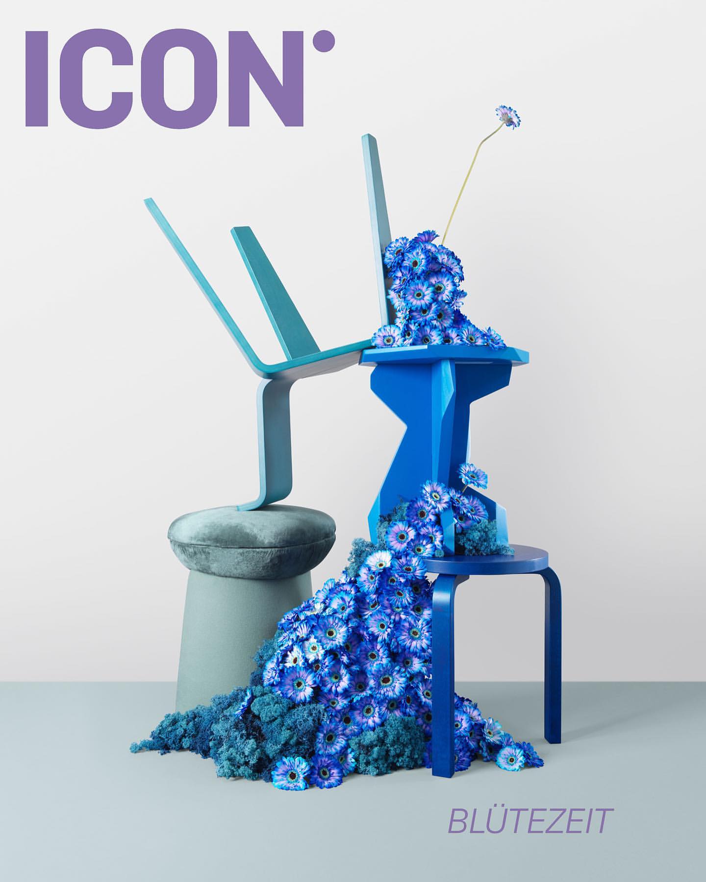 Cover art for ICON magazine featuring an upside down chair balanced on a stool, blue flowers cascading down the furniture.