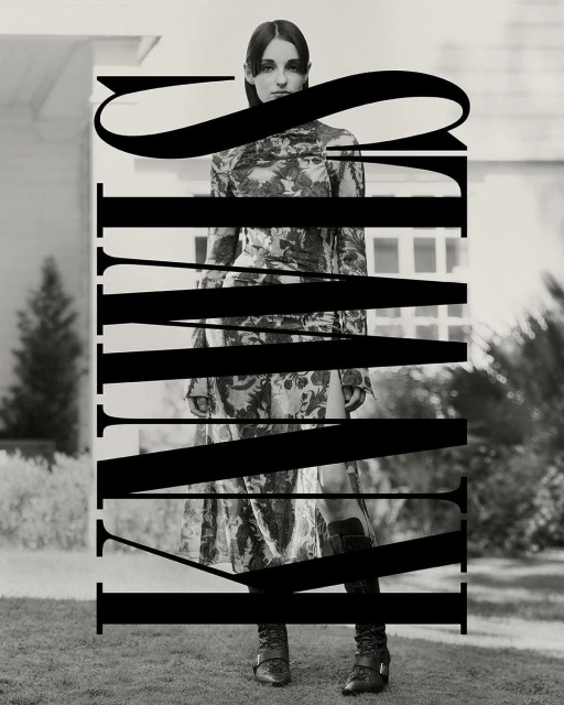 Editorial fashion shot of an adult female in floral dress and boots standing on a lawn in front of a white house, overlaid with text.