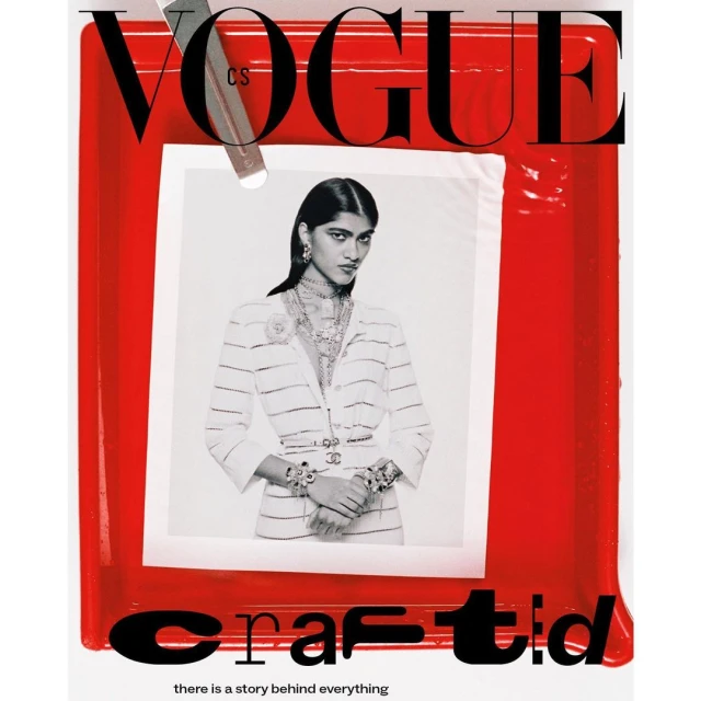 Vogue cover featuring a woman wearing a white striped suit and jewelry, set against a red frame with 'crafted' text, shot in a photo studio.