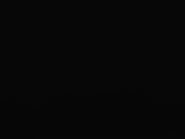 Solid black background with no discernible details or subjects visible in the frame, creating a sense of emptiness and darkness.