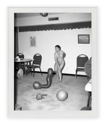 Black and white framed photographic print of a nude figure in a domestic interior with distorted objects