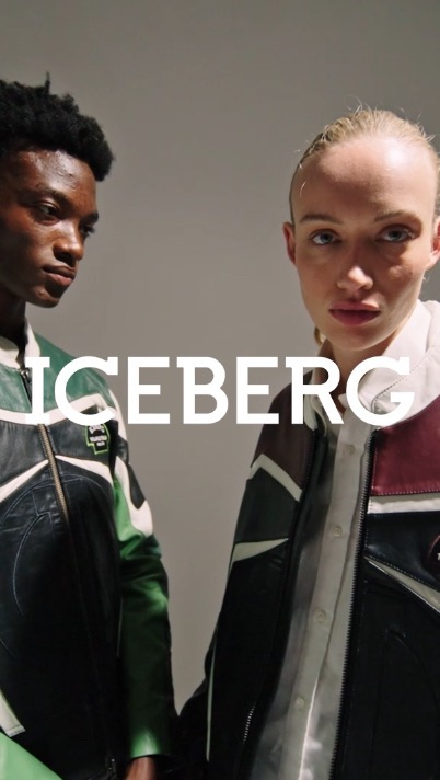 Two models wearing color-blocked leather jackets standing against a plain background with ICEBERG text overlay