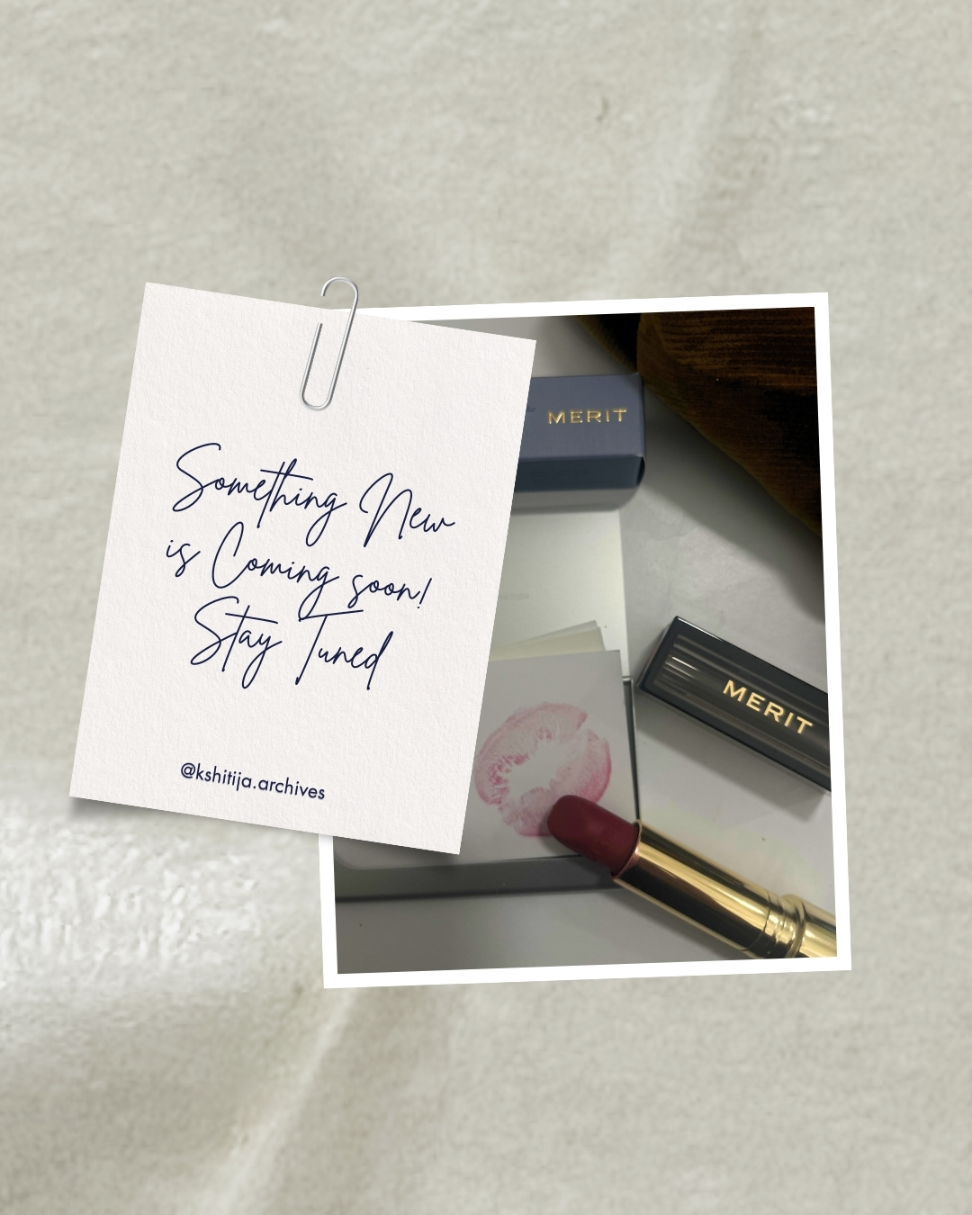 Cosmetics still life: lipstick, lip print, Merit product packaging, and an announcement card for a new product launch.