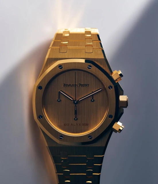Close-up studio shot of a gold Audemars Piguet wristwatch with gold hardware. The luxury watch shows the time with a minimalist design.