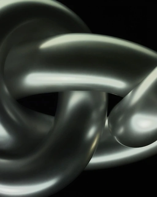 Close-up of a metallic chain with interconnected links against a black background, showcasing its form, texture, and light reflection.