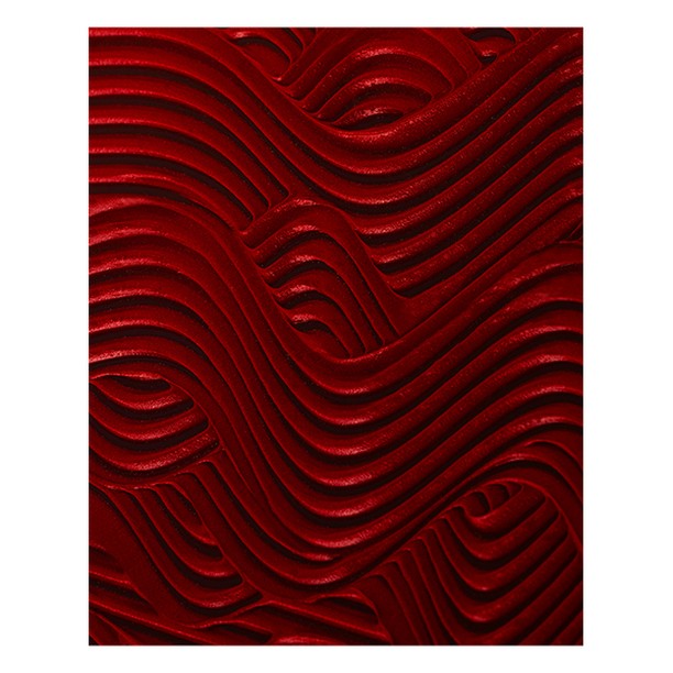 Abstract red texture with wave-like ridges creates a visually dynamic and striking pattern, well-suited for backgrounds and artistic projects.