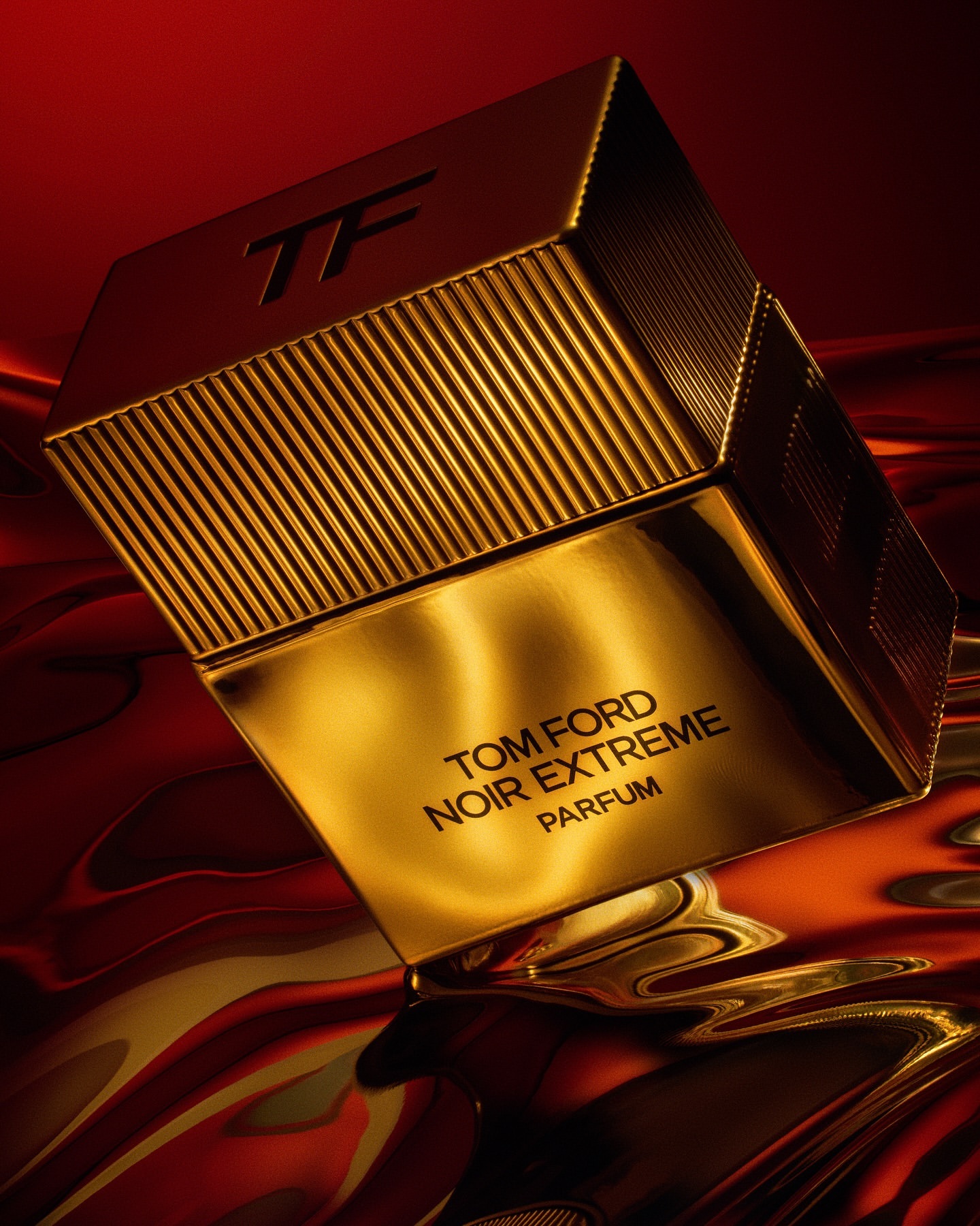A golden bottle of Tom Ford Noir Extreme Parfum is showcased against a textured red and gold background, highlighting luxury and elegance.