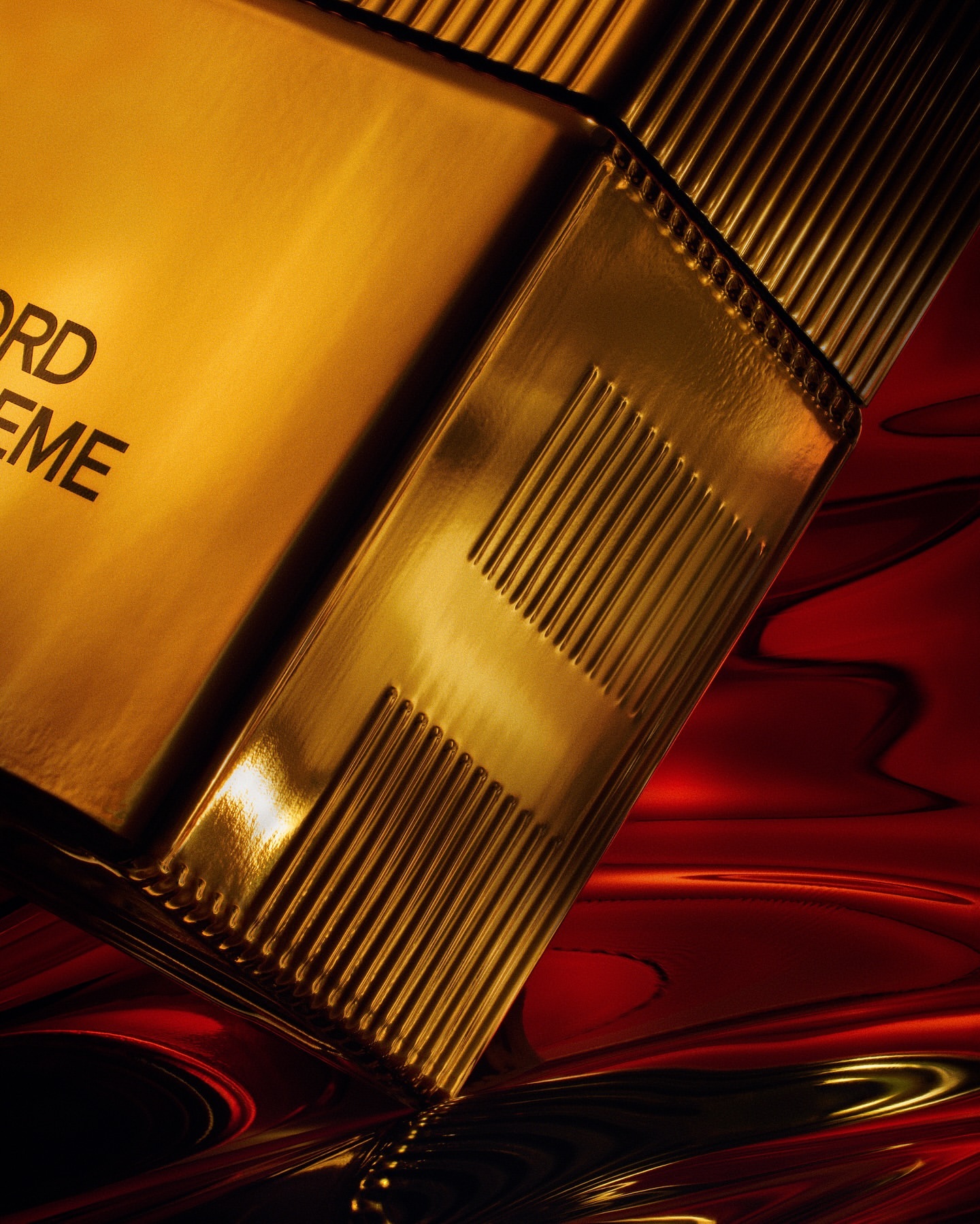 Close-up studio shot of a gold Tom Ford Extreme perfume bottle with a sleek, geometric design against a blurred red background.