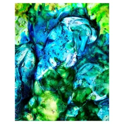 Macro abstract image of swirling blue and green translucent liquid with suspended air bubbles.
